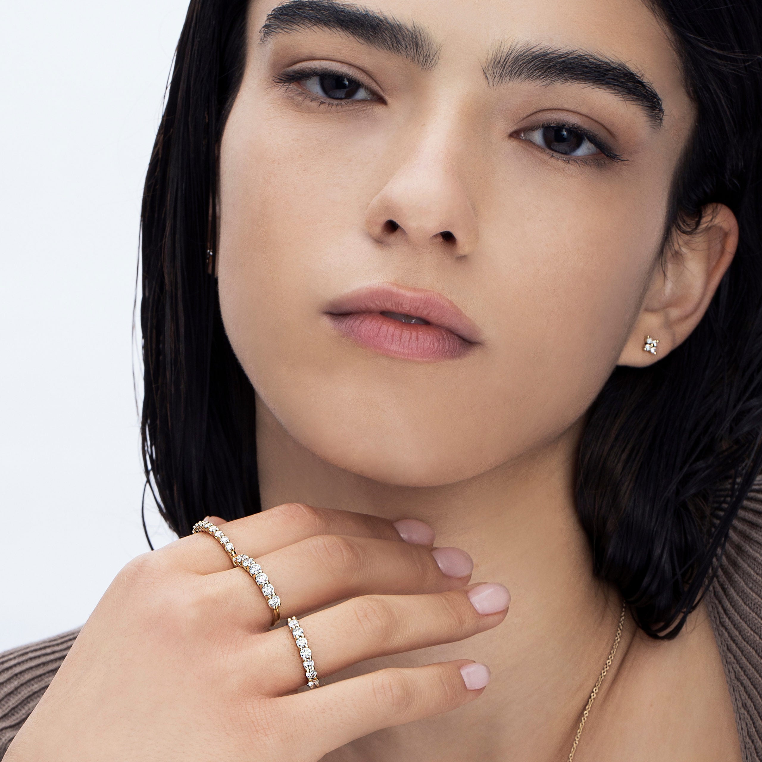 Gold ring with 9 laboratory diamonds weighing 5 points per diamond