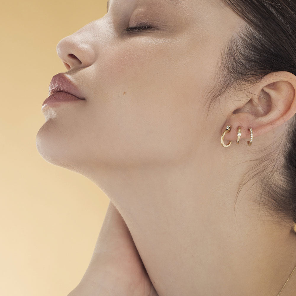 Classic small hoop earrings studded with white diamonds