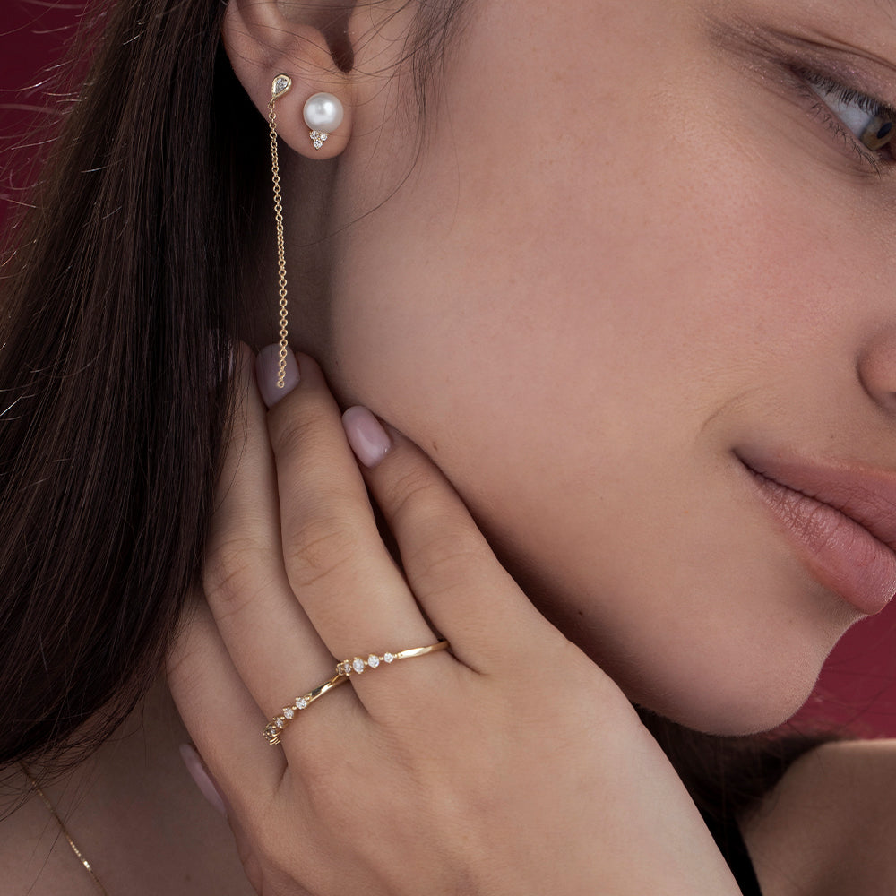A delicate diamond ring set with 5 diamonds in a special setting