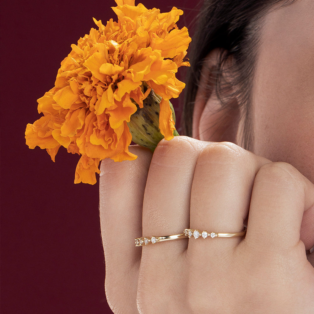 A delicate diamond ring set with 7 diamonds in a special setting