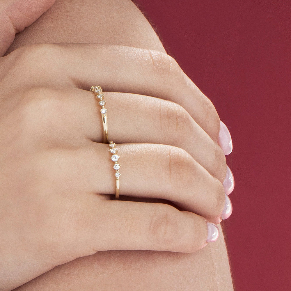 A delicate diamond ring set with 5 diamonds in a special setting