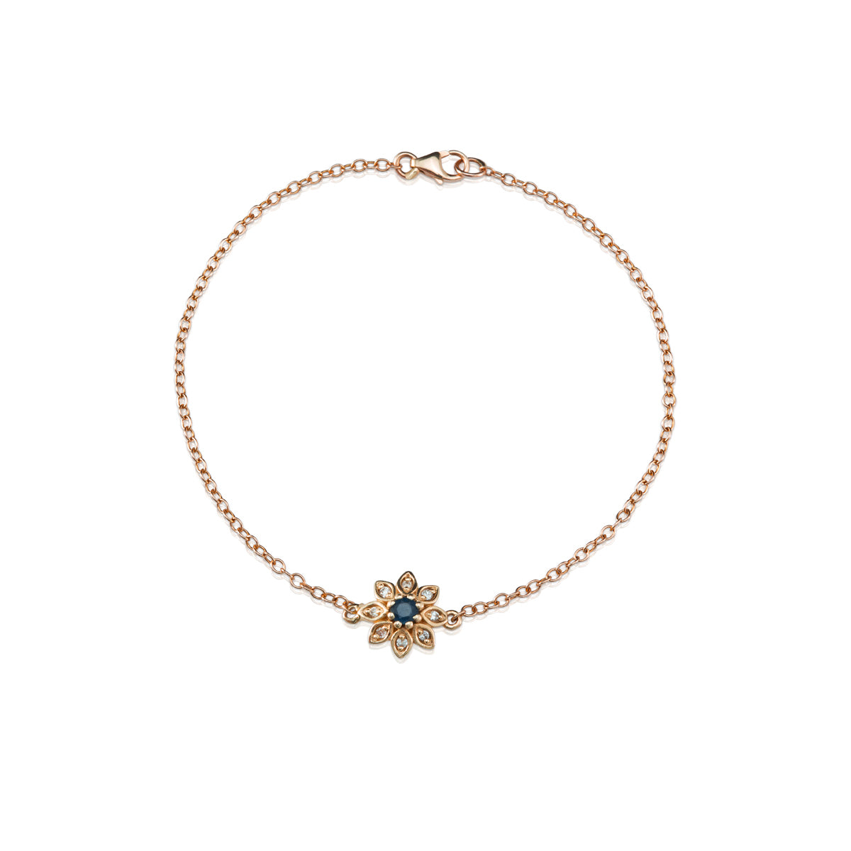 Gold bracelet with a flower studded with diamonds and sapphires