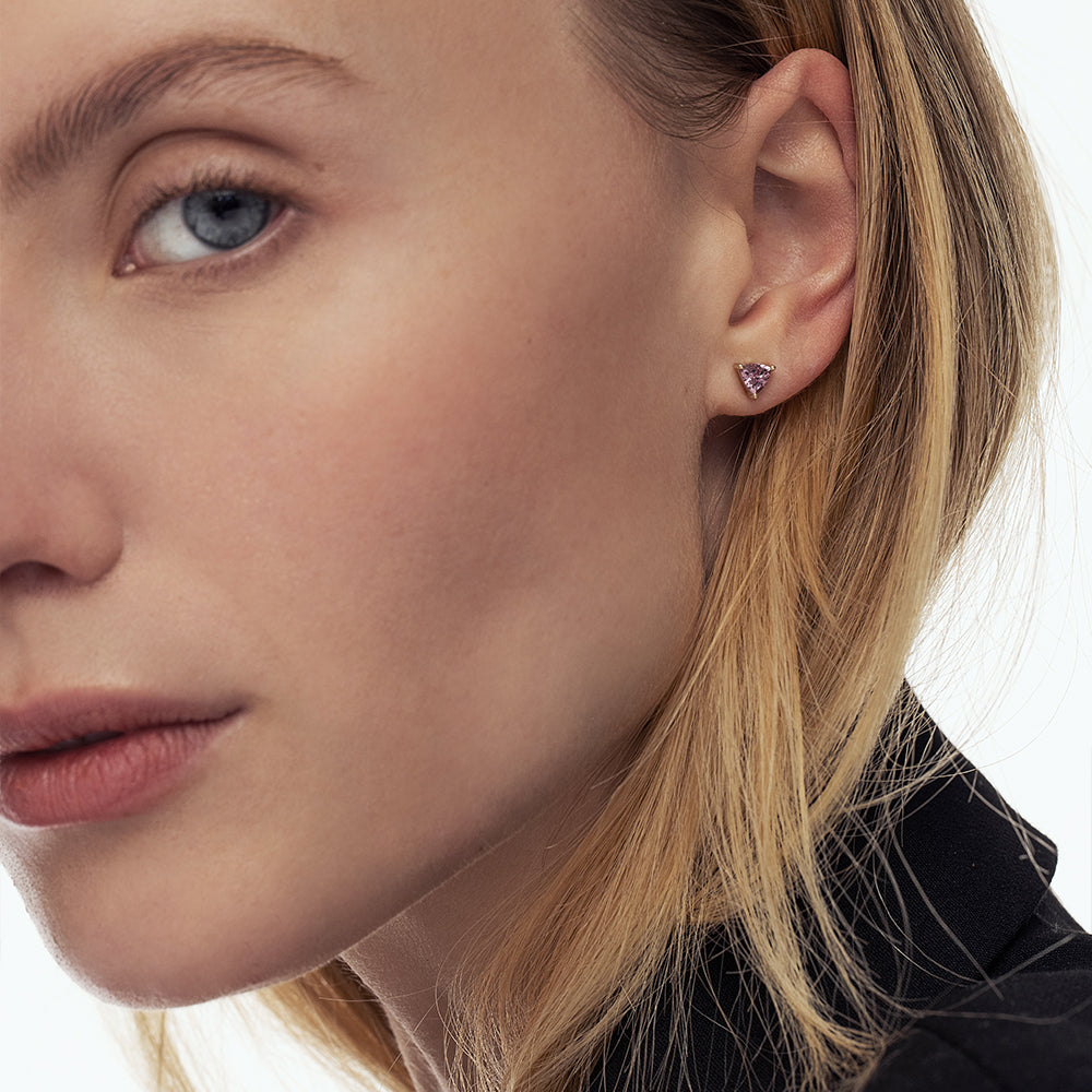 Gold studded gold earrings set with trillion-cut champagne garnet