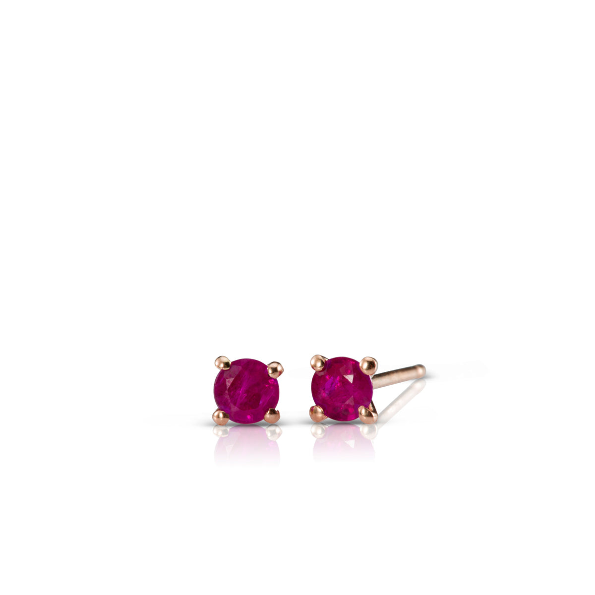 Gold solitaire earrings studded with ruby stones