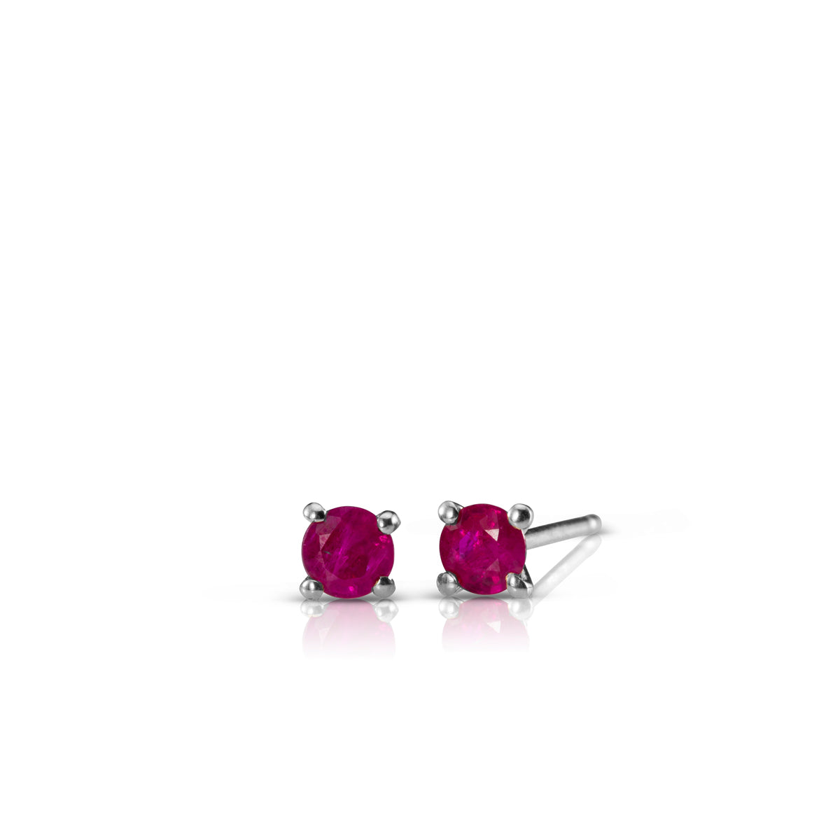 Gold solitaire earrings studded with ruby stones