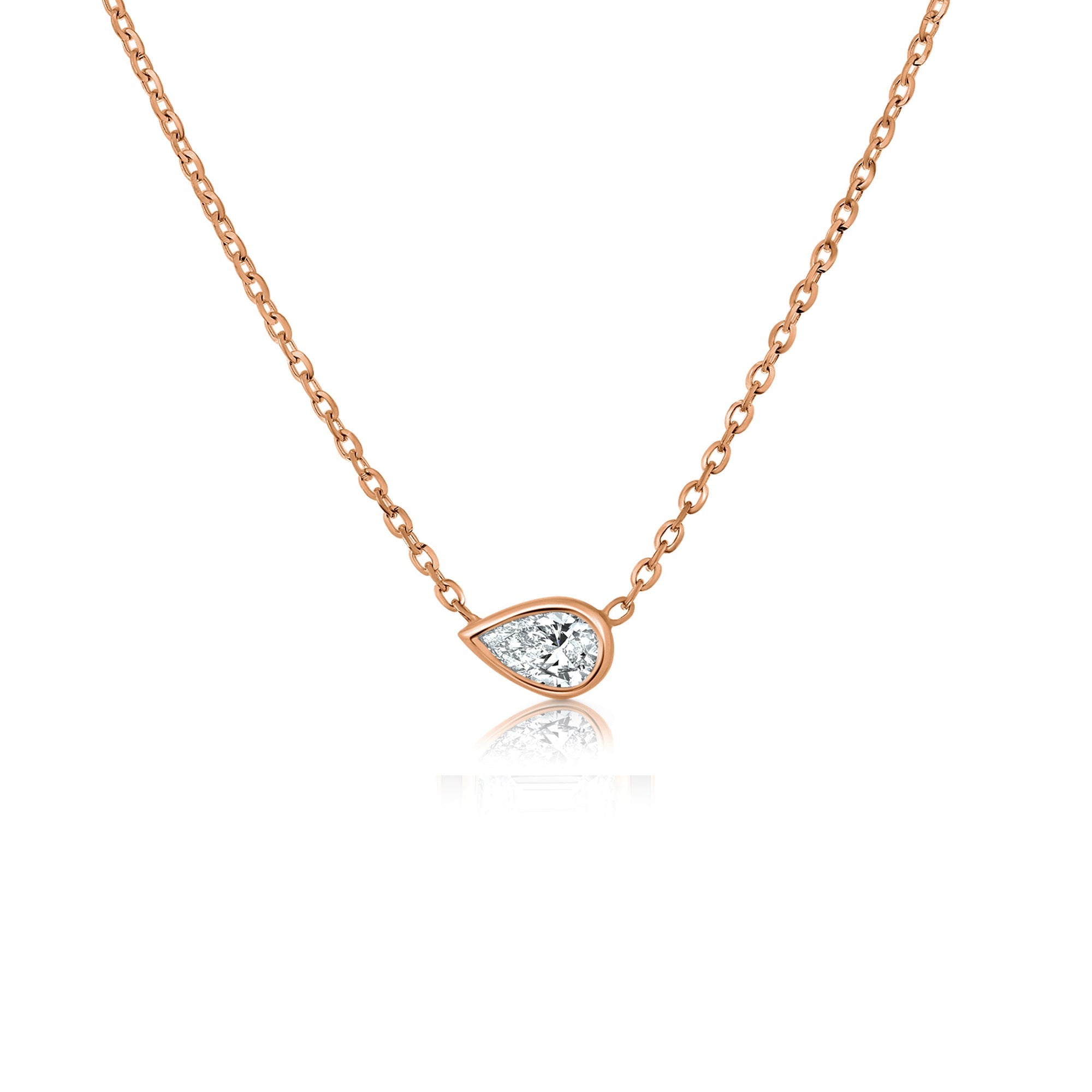 A special gold chain set with a laboratory diamond in a horizontal drop cut