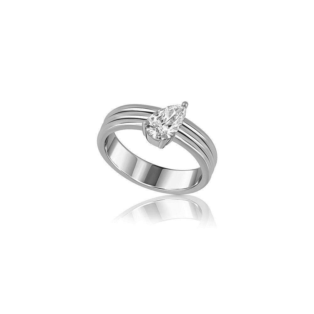 A wide gold ring set with a drop-cut lab diamond