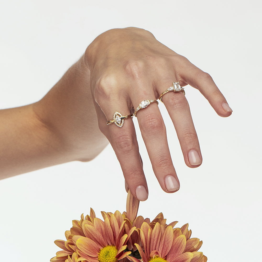 A unique engagement ring set with a laboratory diamond in a horizontal oval cut