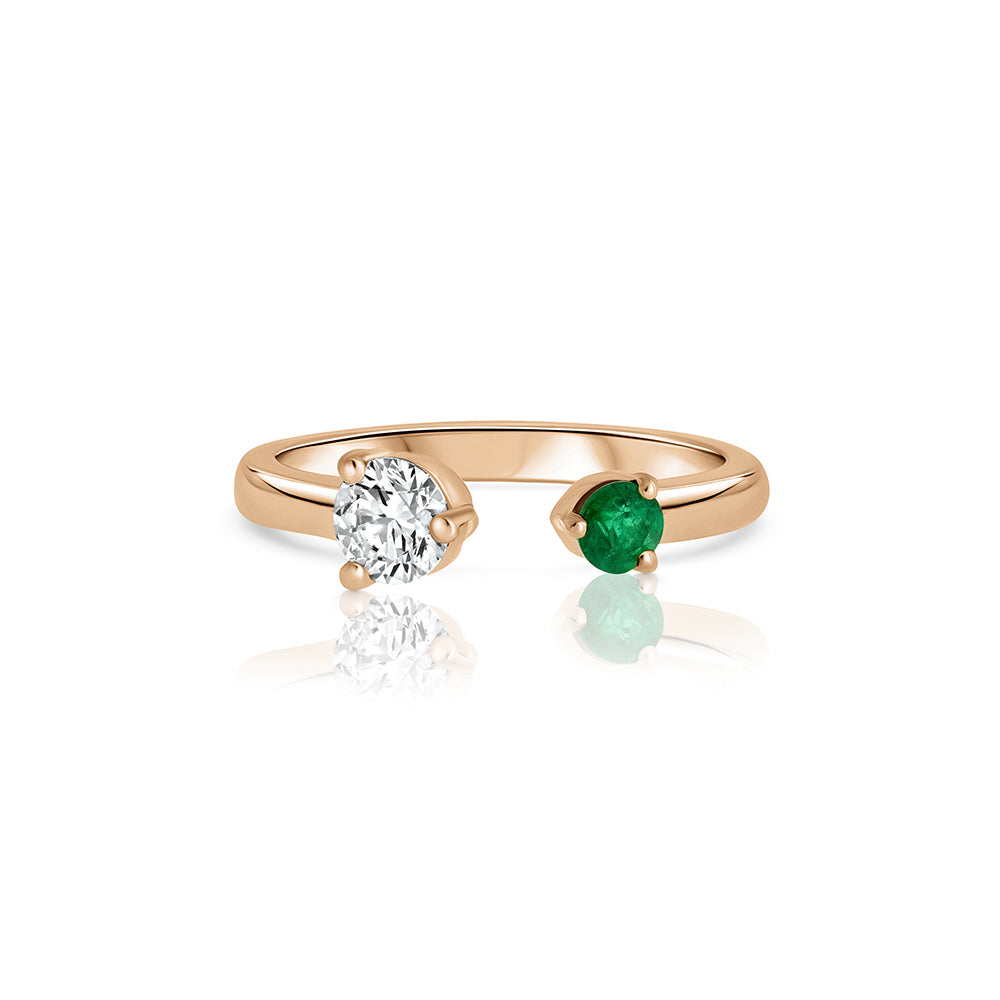 Open gold and diamond ring. A ring set with a laboratory diamond weighing 30 points and a natural emerald.