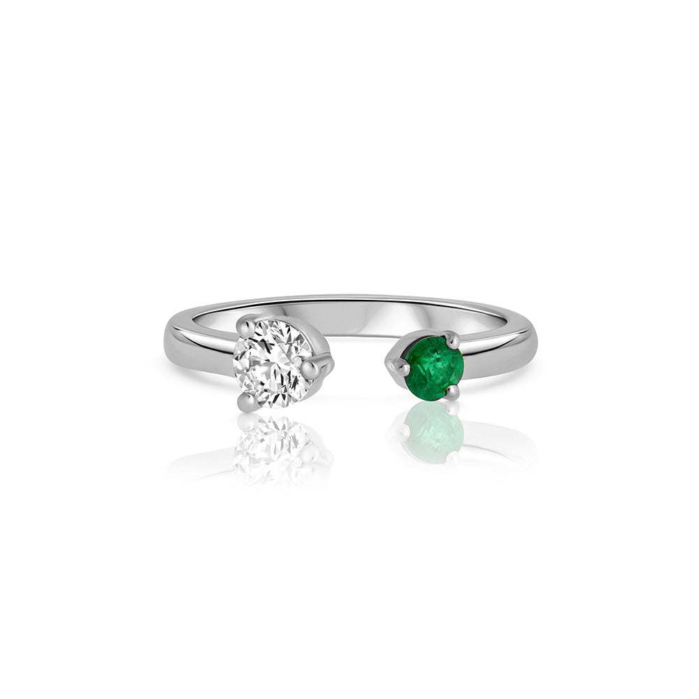 Open gold and diamond ring. A ring set with a laboratory diamond weighing 30 points and a natural emerald.