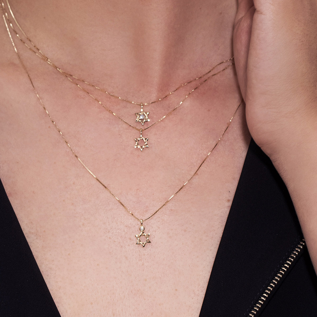 Gold necklace with a small Star of David pendant, 8 millimeters wide, 14 carat gold