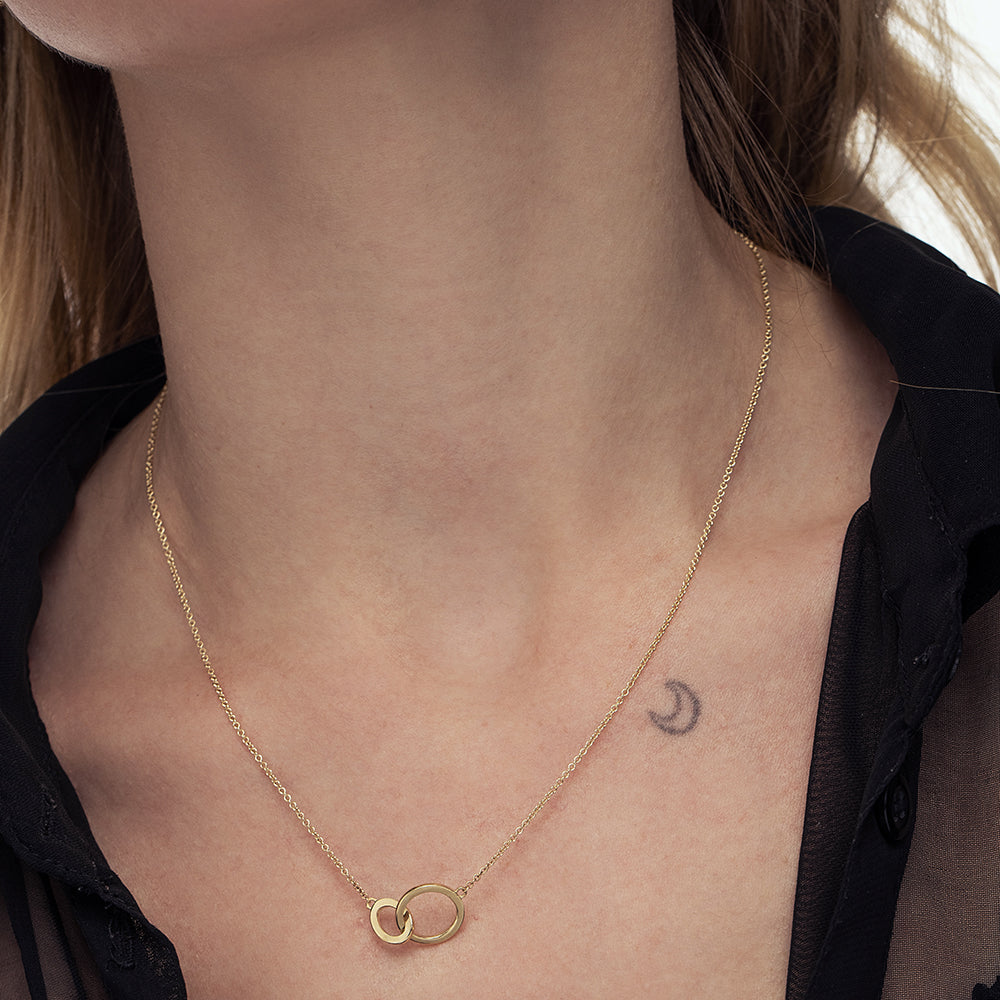 Gold necklace with pendant combined loops