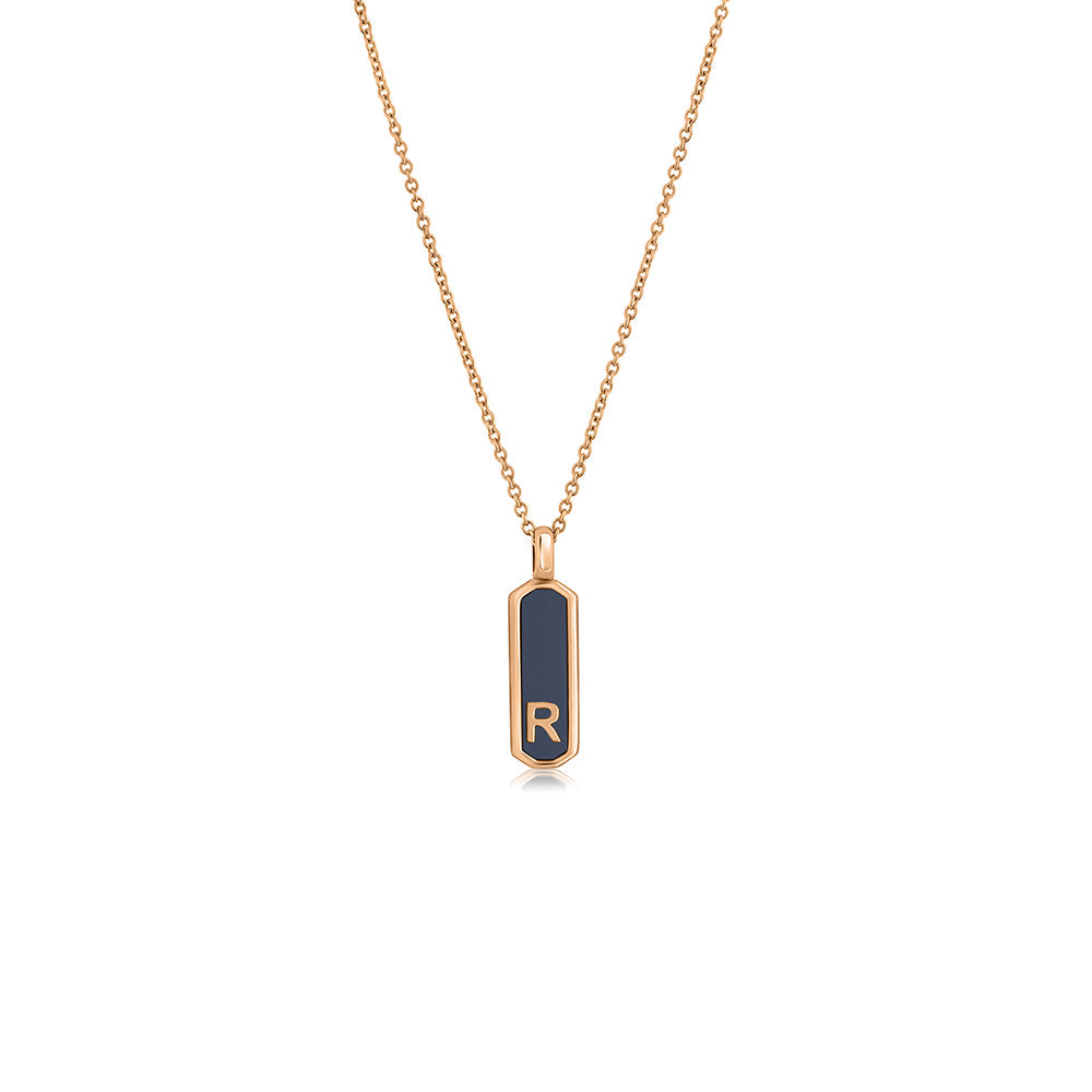 Gold necklace with two-sided narrow letter pendant combined with enamel