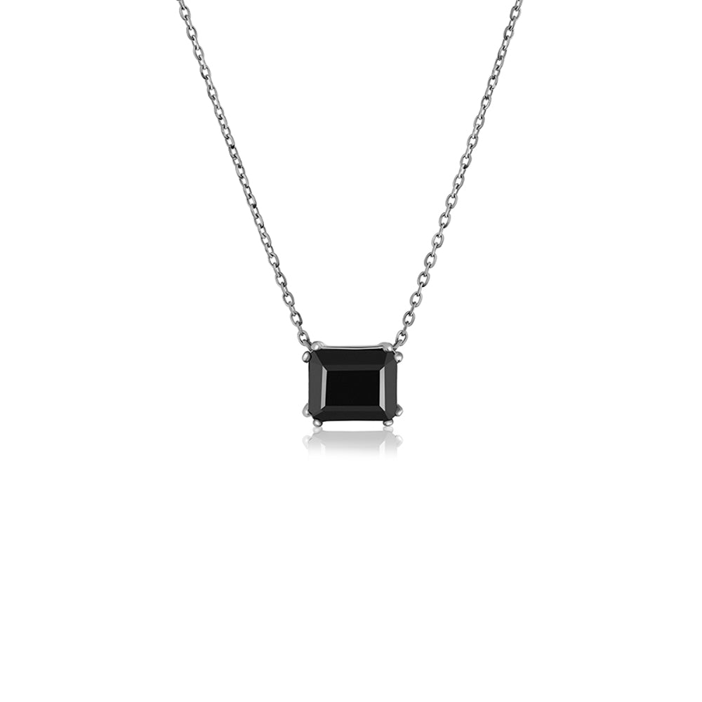 A gold necklace for a woman inlaid with a rectangular black onyx