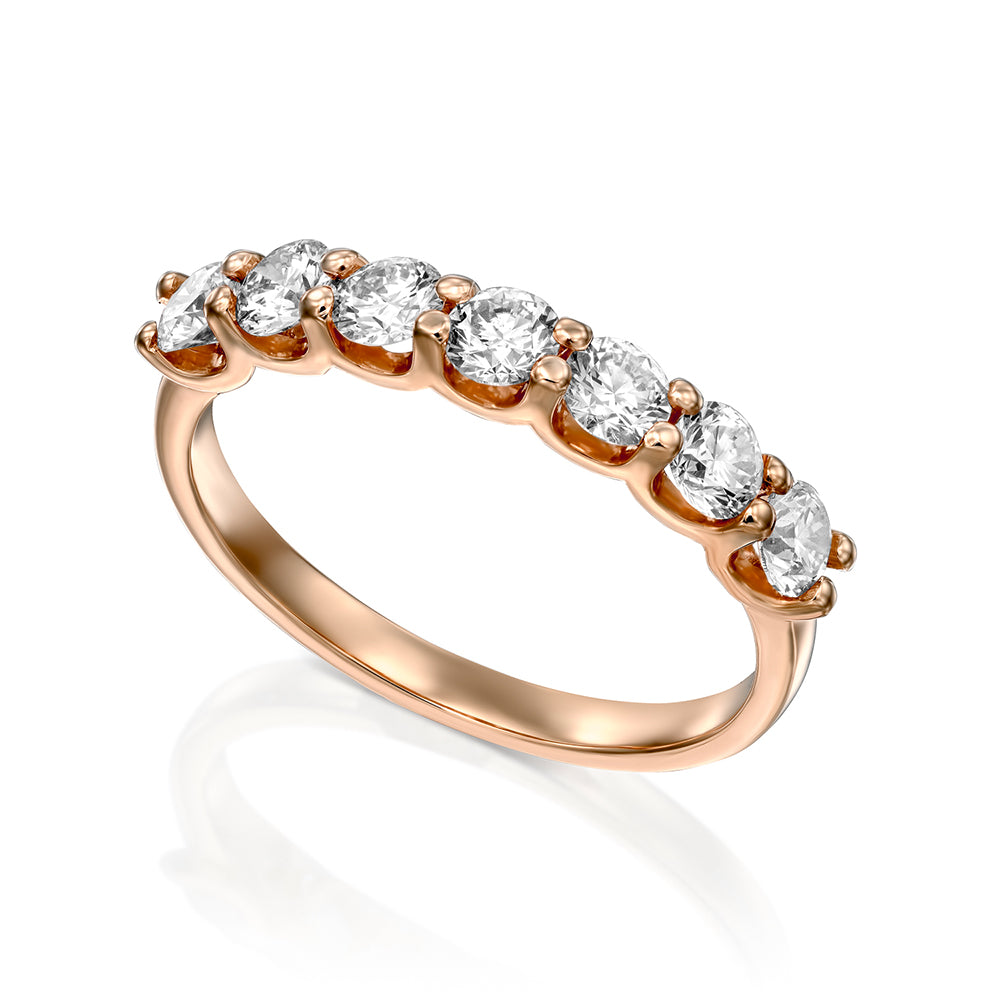 Gold ring with 7 diamonds weighing 15 points per diamond