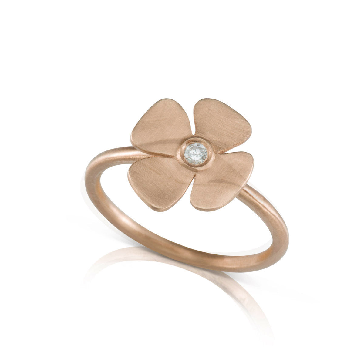 A gold and diamond flower ring with a delicate design