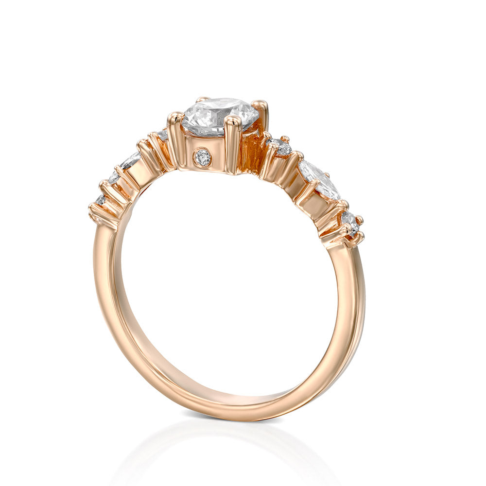 A diamond ring set with a 0.60 carat round diamond combined with marquise-cut diamonds