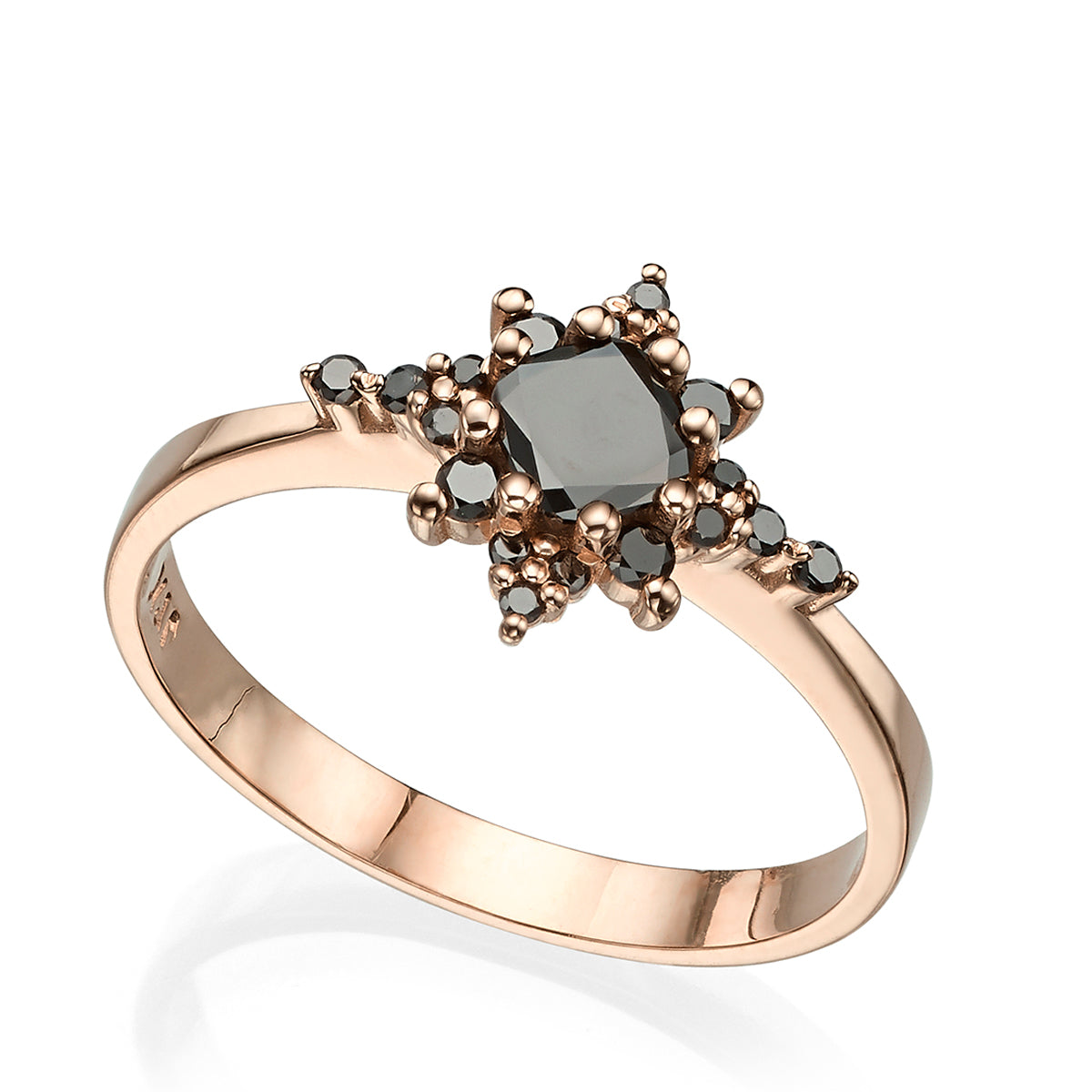 A black diamond star ring, with a central brilliant cut diamond
