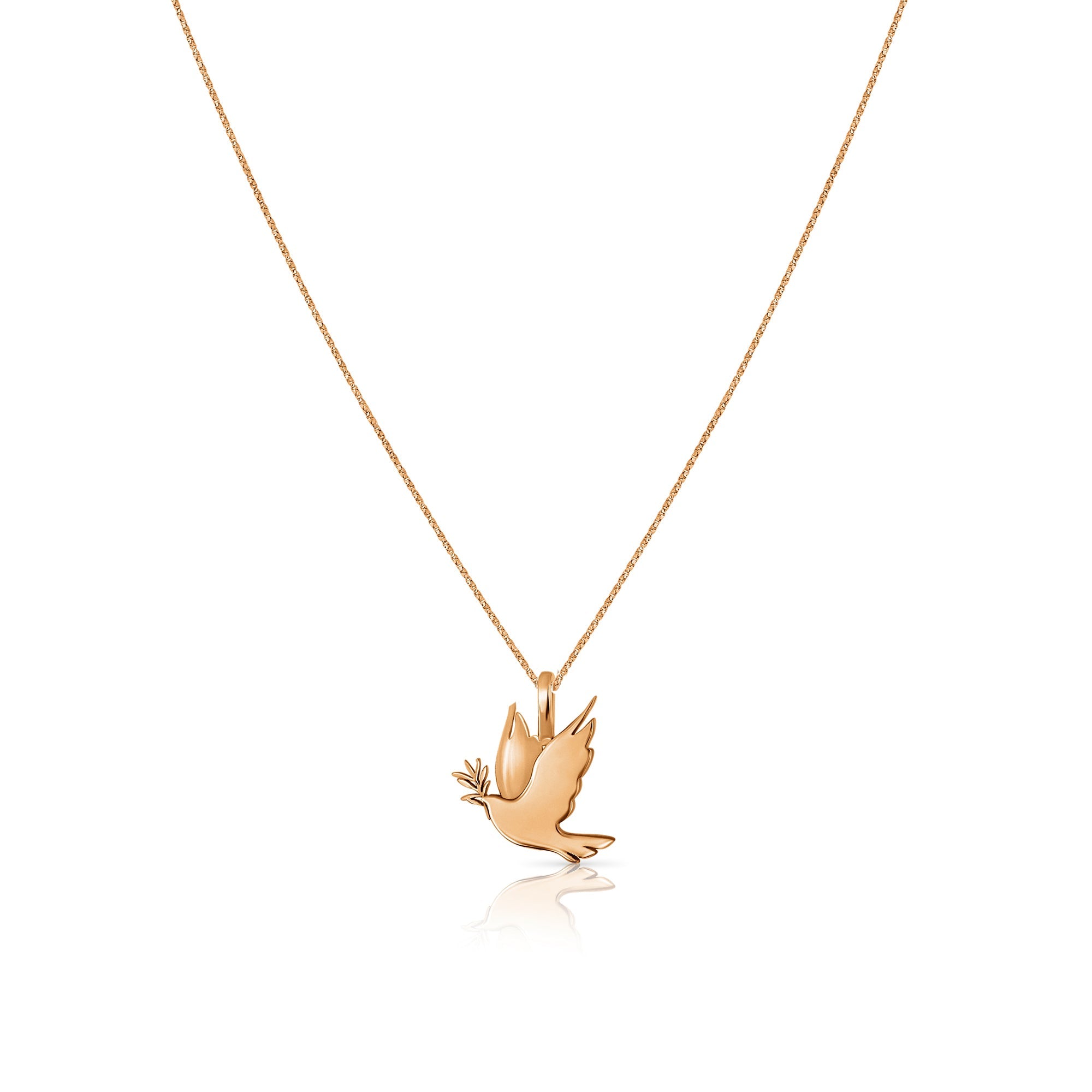 A gold necklace with a dove of peace pendant and an olive leaf