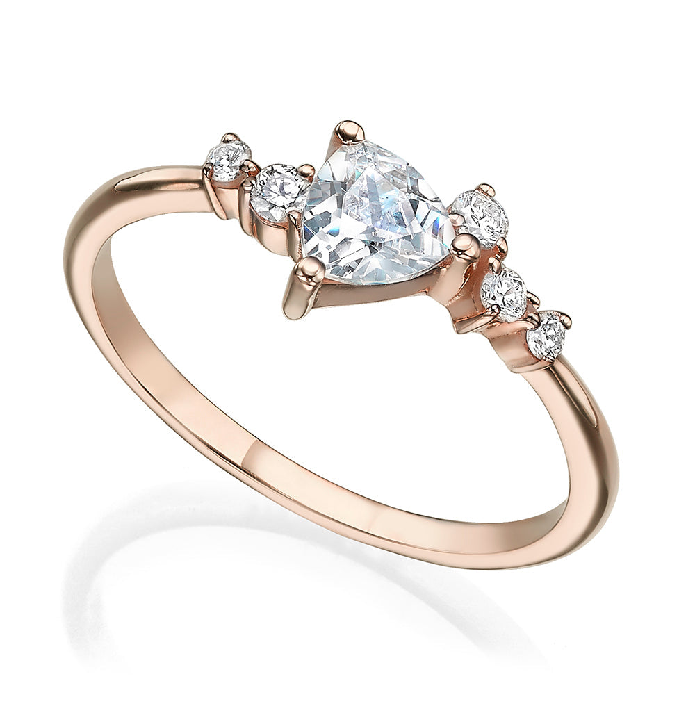 An engagement ring set with a trillion-cut diamond and diamonds all around