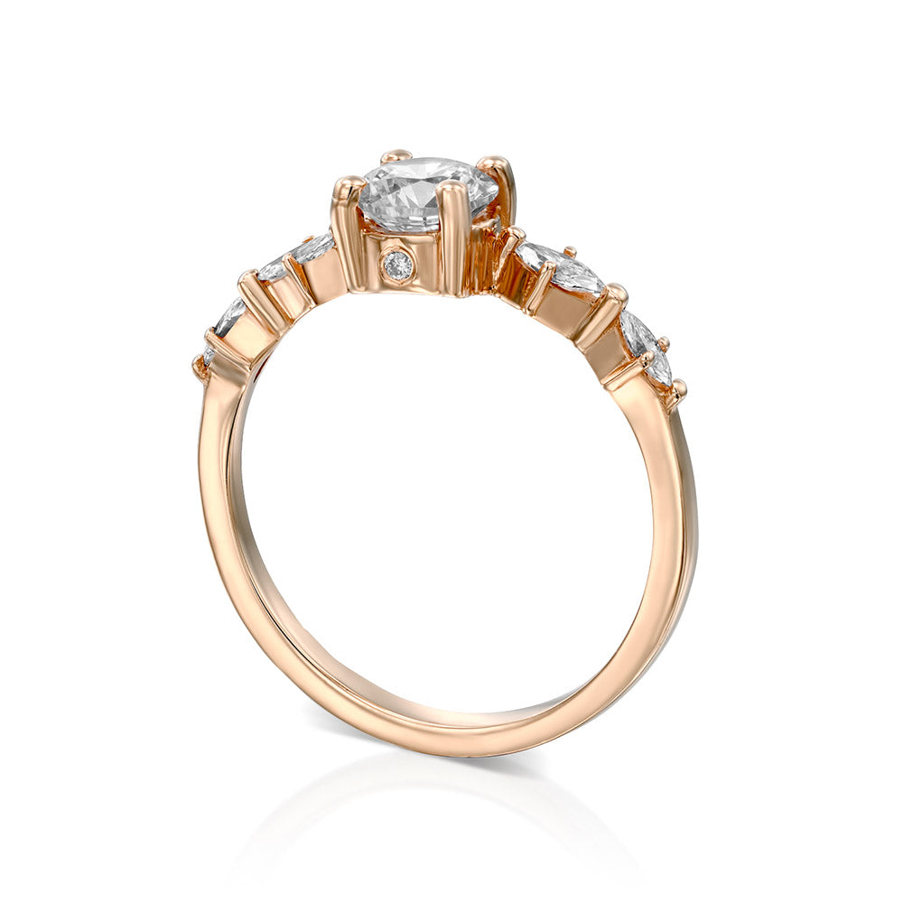 Engagement ring set with a central round diamond 0.60 carat and marquise diamonds