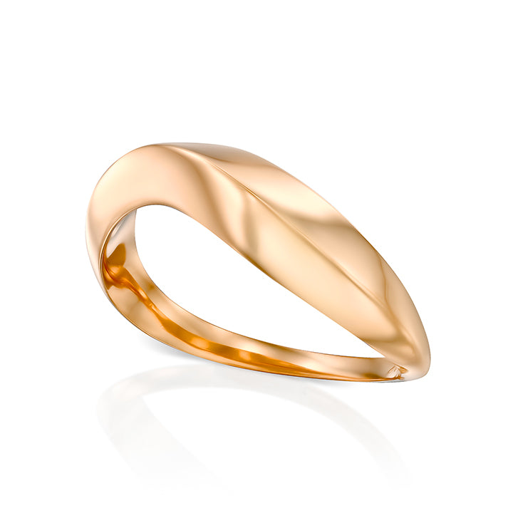 A thick geometric wave-shaped gold ring