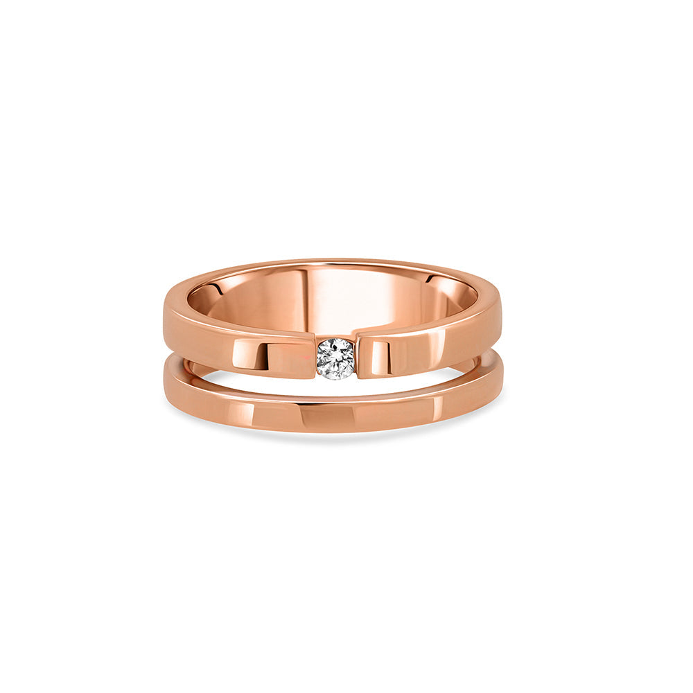 A double gold ring set with a round diamond weighing 5 points