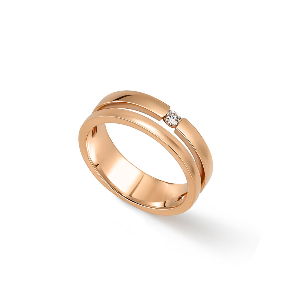 A double gold ring set with a round diamond weighing 5 points