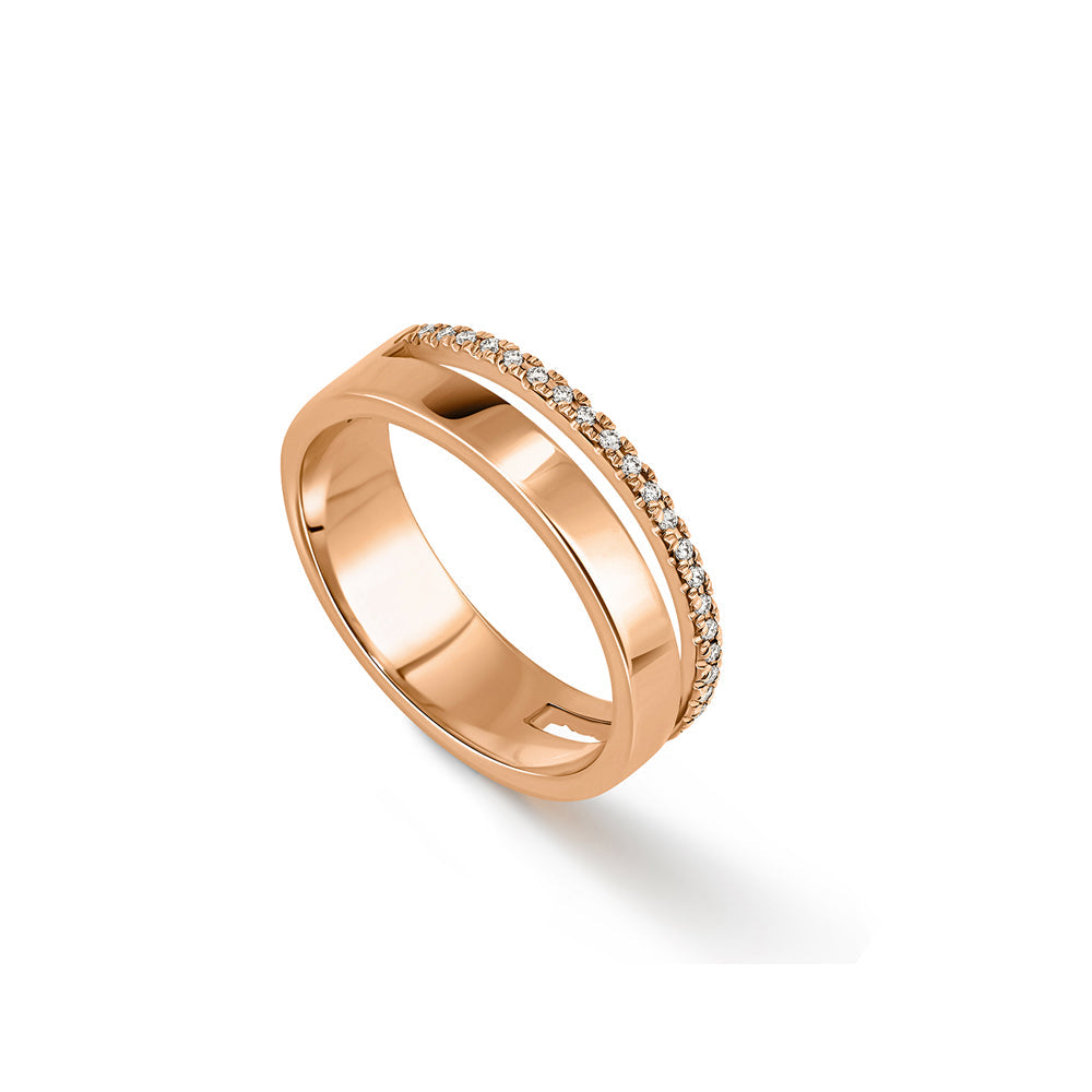 A double gold ring set with a row of diamonds and a smooth wide band