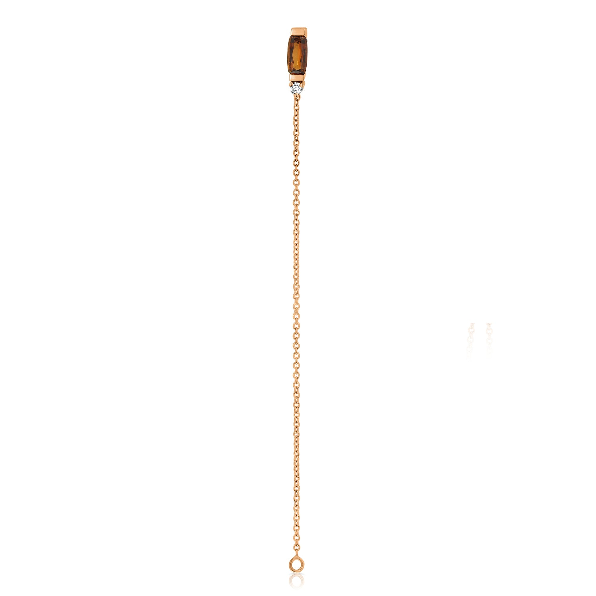 A special gold chain earring studded with gemstone, tourmaline and diamond