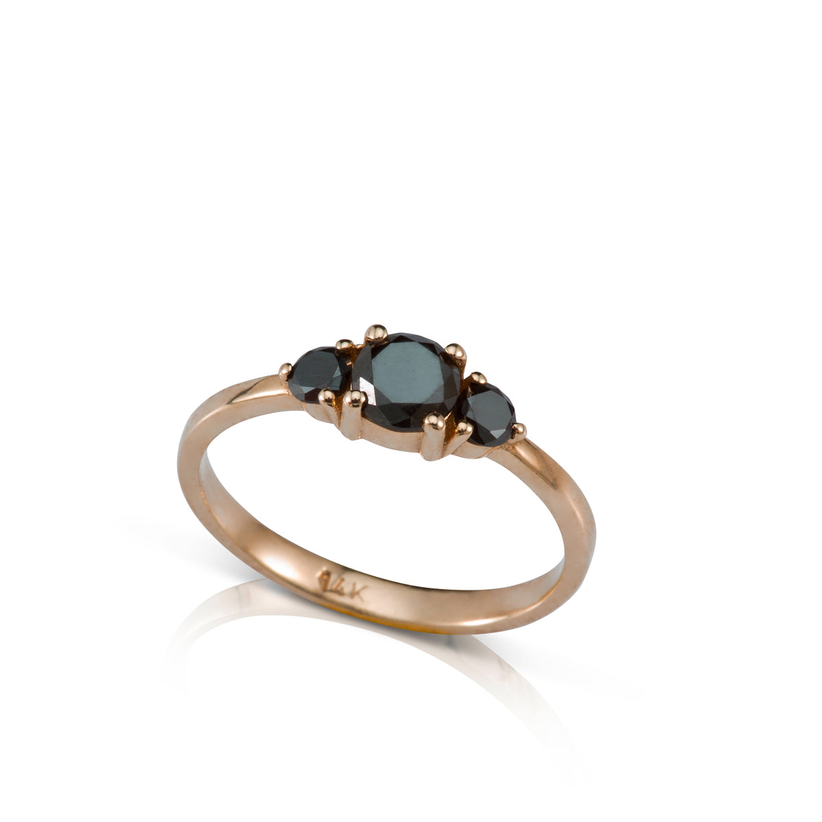 Engagement ring set with a central black diamond and black diamonds on the sides