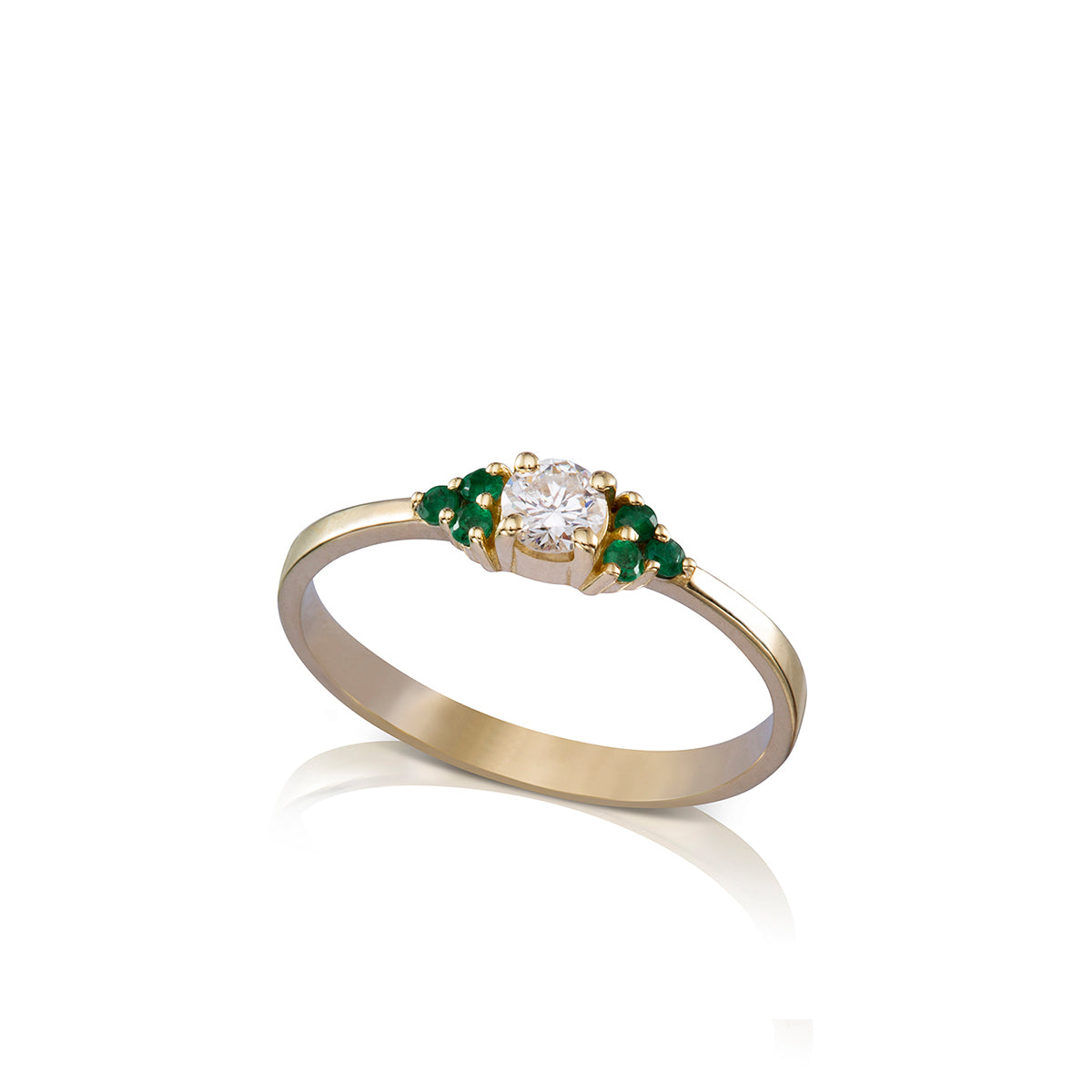 Engagement ring set with a central diamond 0.20ct and 6 emeralds