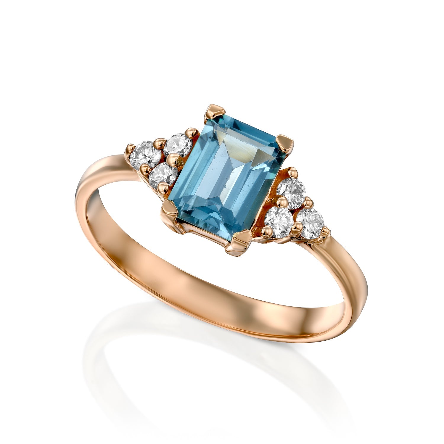 An engagement ring set with rectangular London blue topaz and 6 sided diamonds