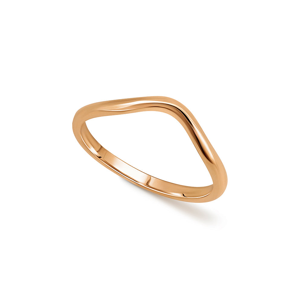 A gold wedding ring in the shape of a wave - a complementary ring