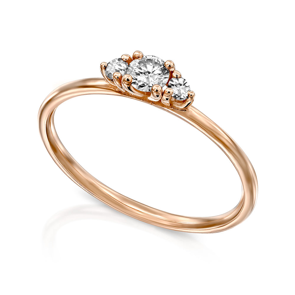 A fine gold ring set with three white laboratory diamonds