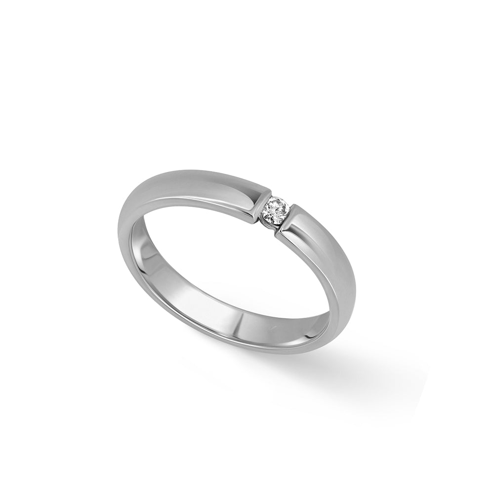 A gold ring set with a round diamond weighing 5 points