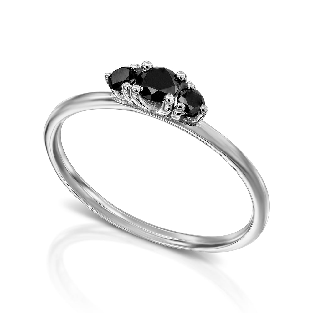 A fine gold ring set with three black diamonds