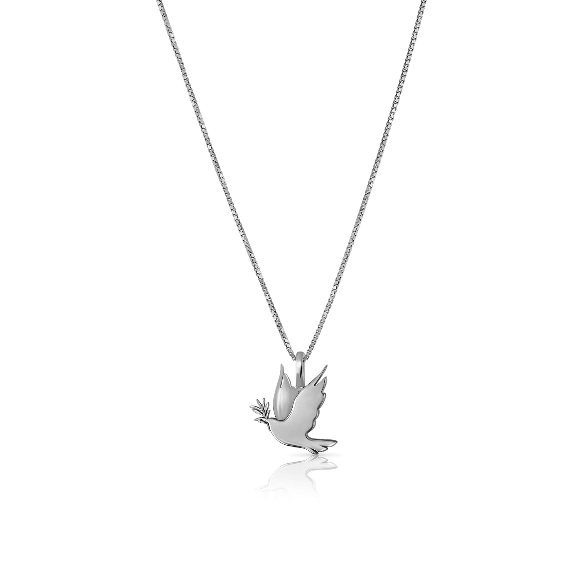 A gold necklace with a dove of peace pendant and an olive leaf
