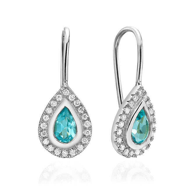Hanging gold earrings studded with blue topaz and diamonds