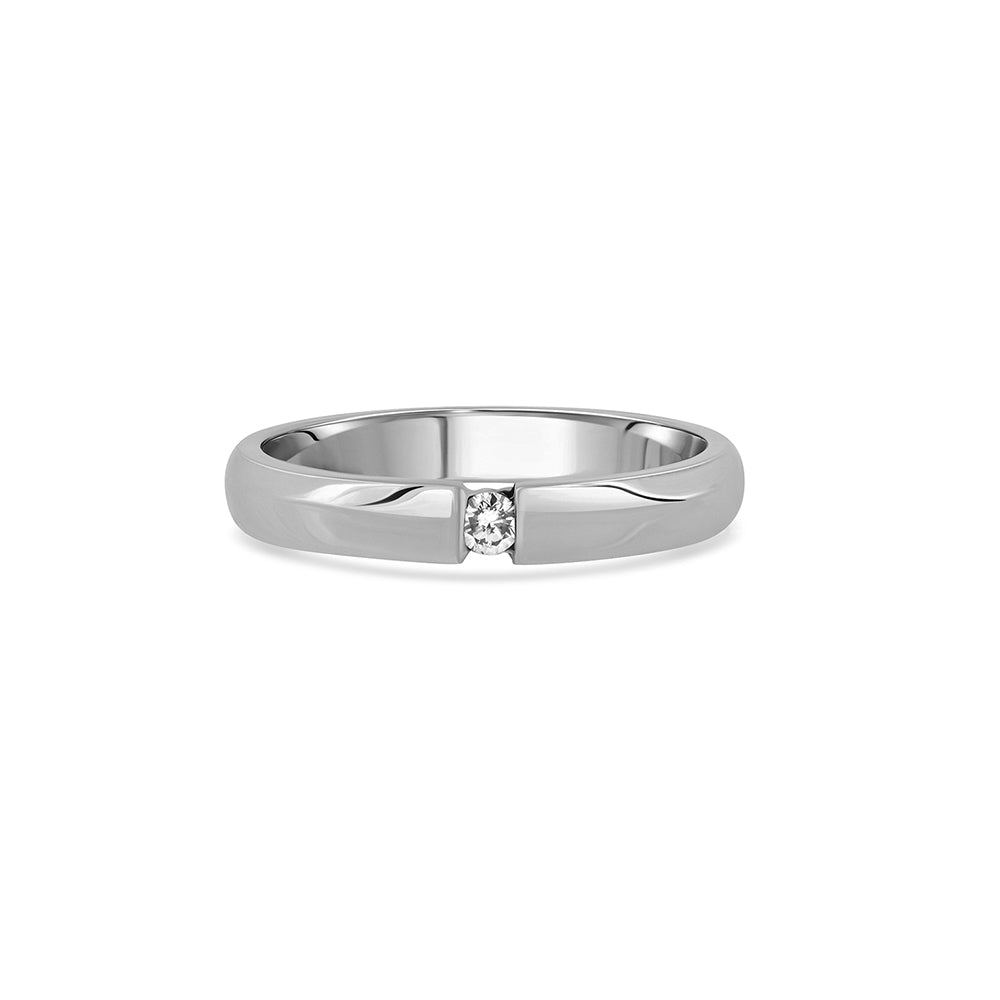 A gold ring set with a round diamond weighing 5 points