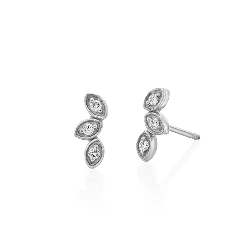 Climbing gold earrings in the shape of three leaves, set with diamonds
