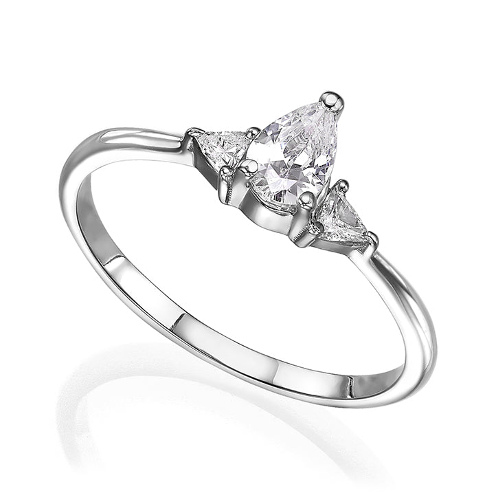 An engagement ring set with a central drop-cut diamond and triangular-cut diamonds on the sides