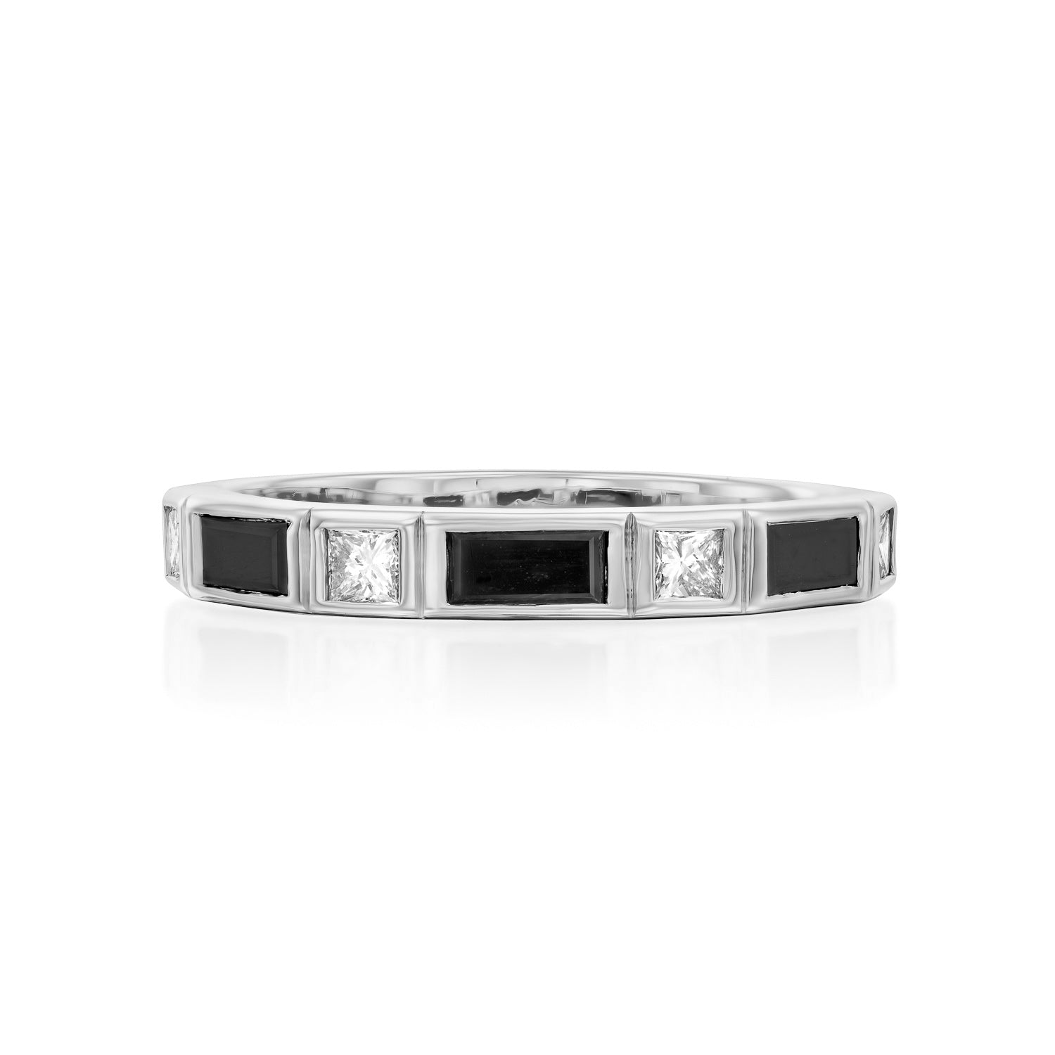 A semi-eternity ring set with baguette-cut black diamonds and princess-cut white diamonds