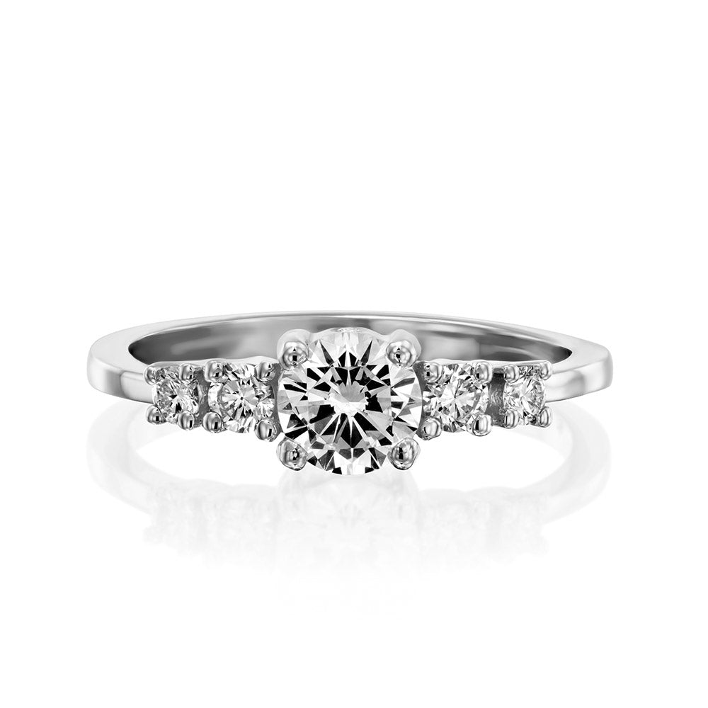 Engagement ring set with a central round diamond and 4 side diamonds