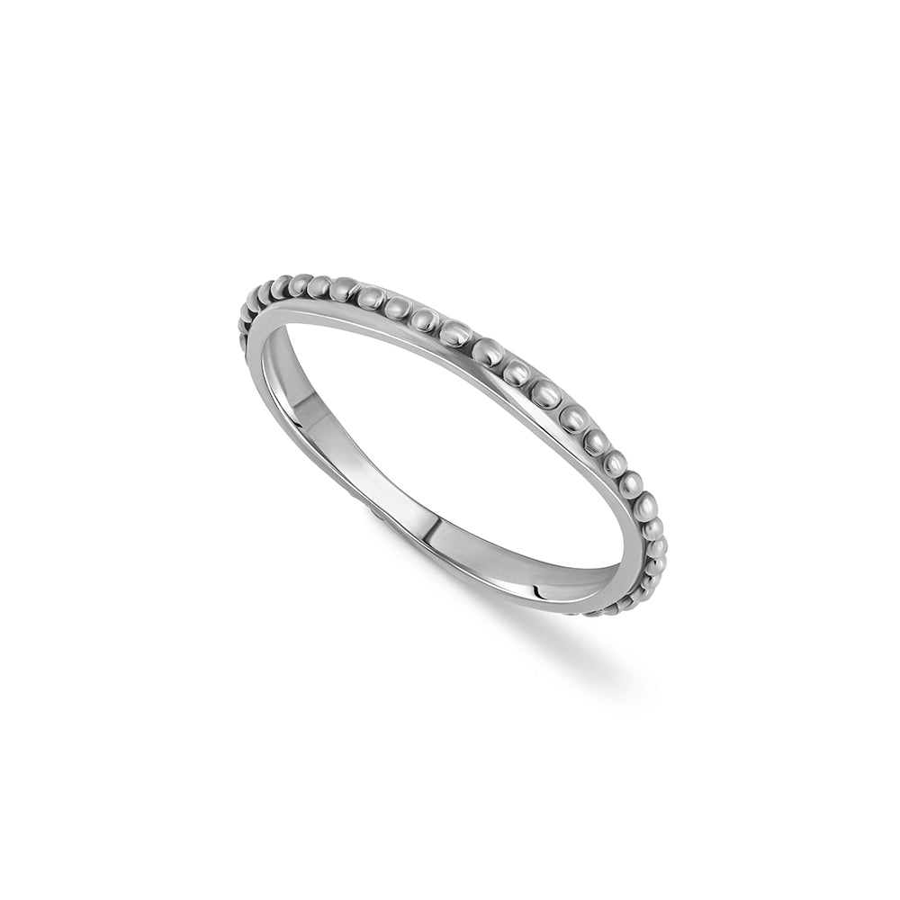 Asymmetric wedding ring decorated with a gold ball