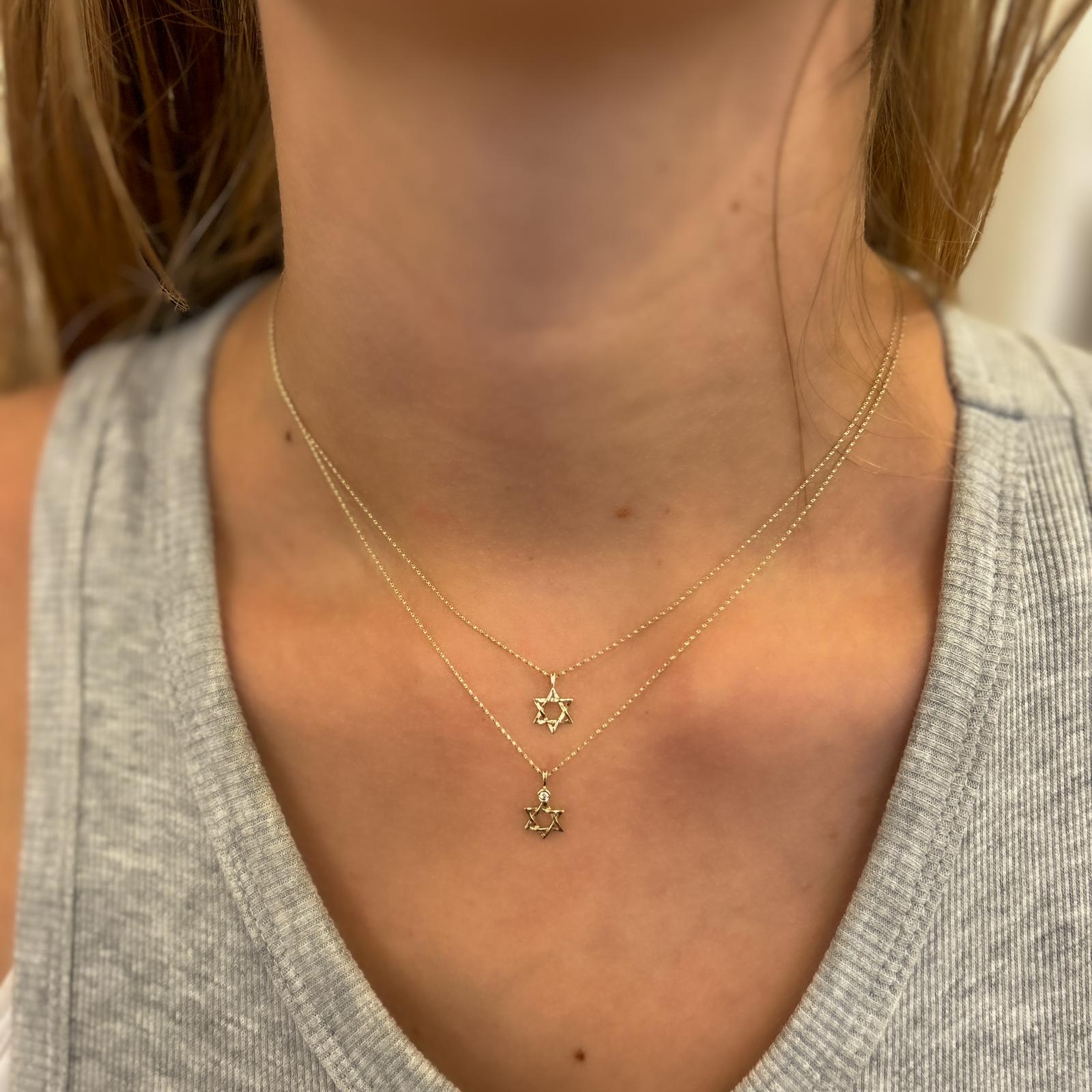 Gold necklace designed with a Star of David pendant set with a diamond, 1.5 points, 14 carat gold
