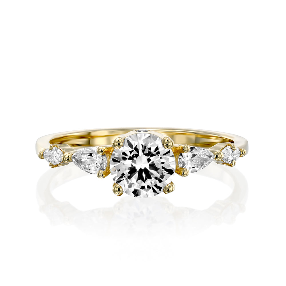 An impressive diamond ring set with a central round diamond combined with drop and marquise cut diamonds