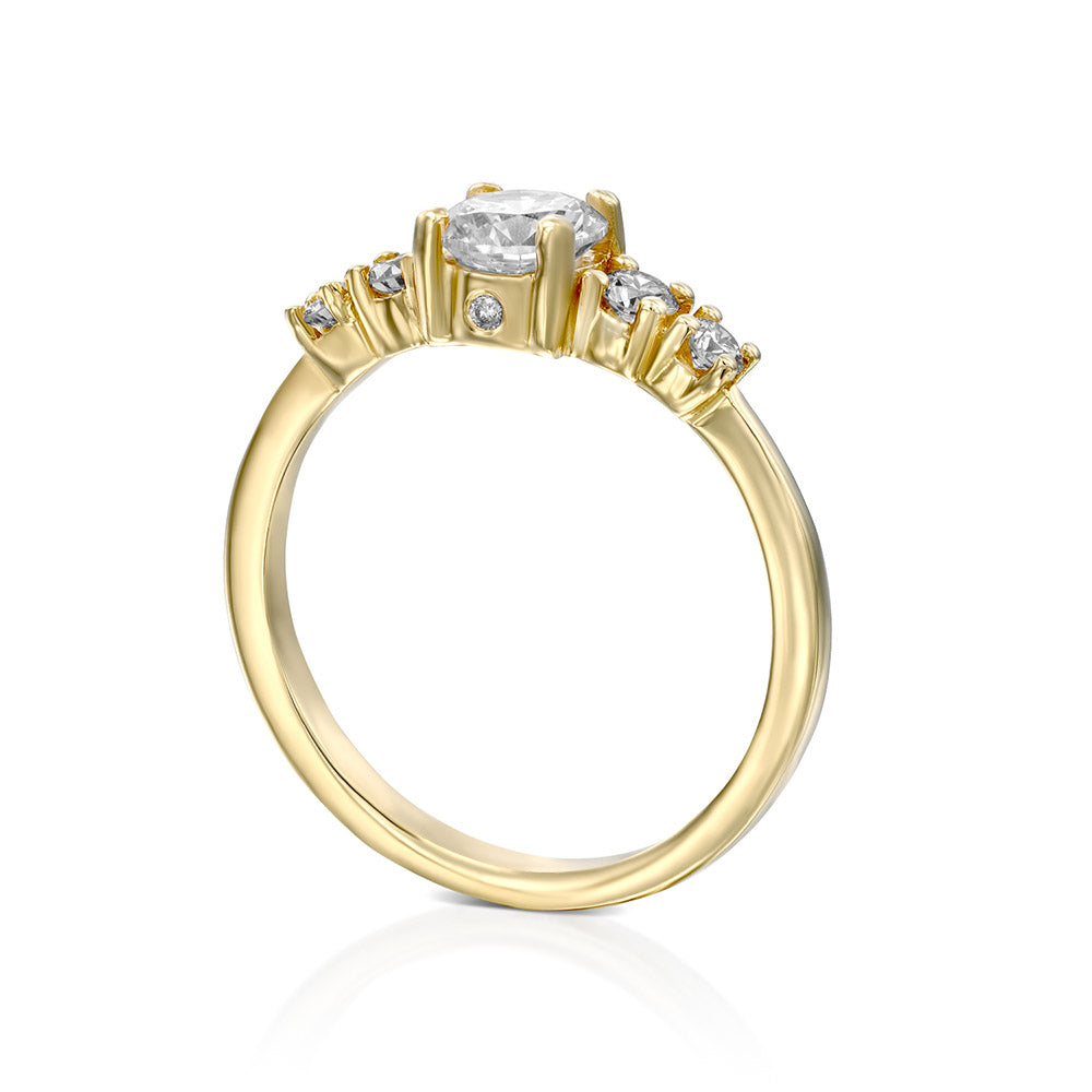 Engagement ring set with a central round diamond and 4 side diamonds
