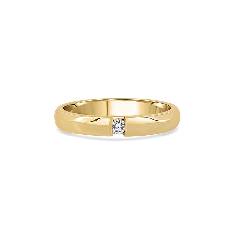 A gold ring set with a round diamond weighing 5 points