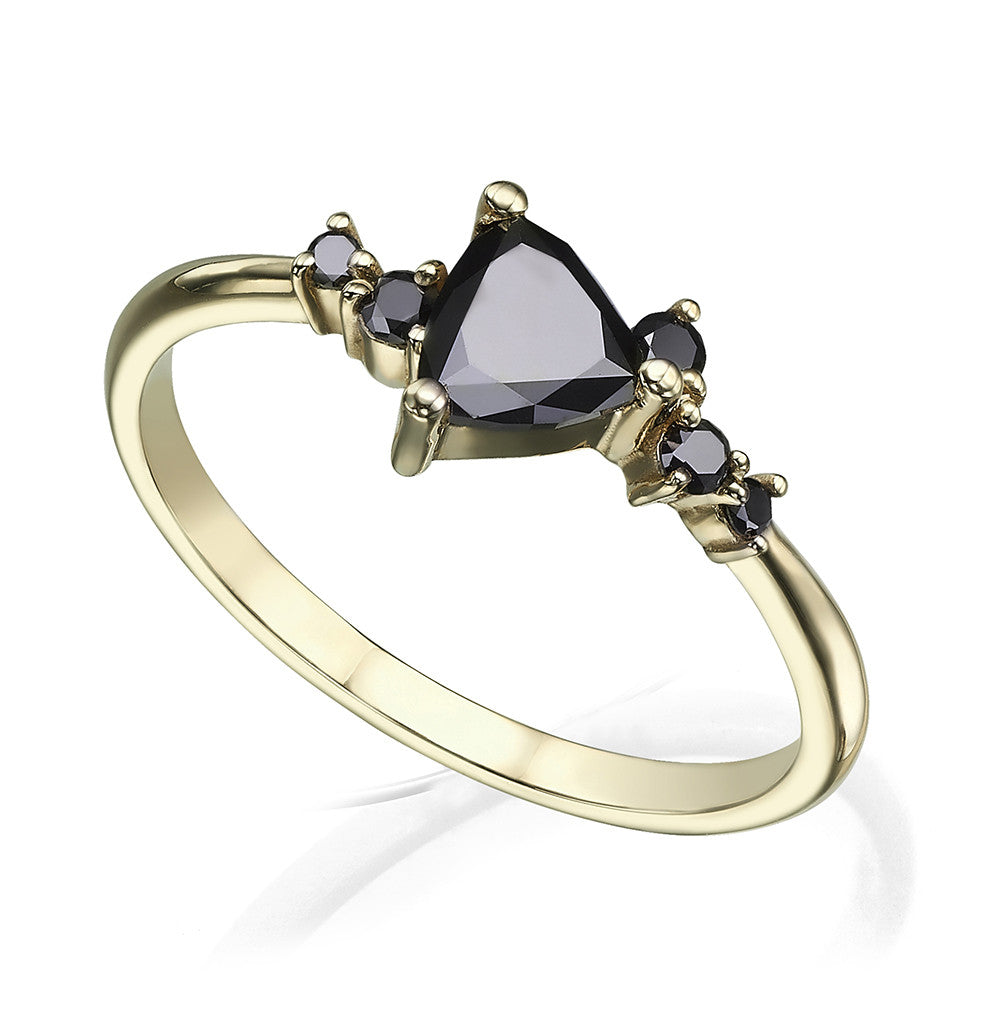 An engagement ring set with a trillion-cut black diamond and black diamonds all around